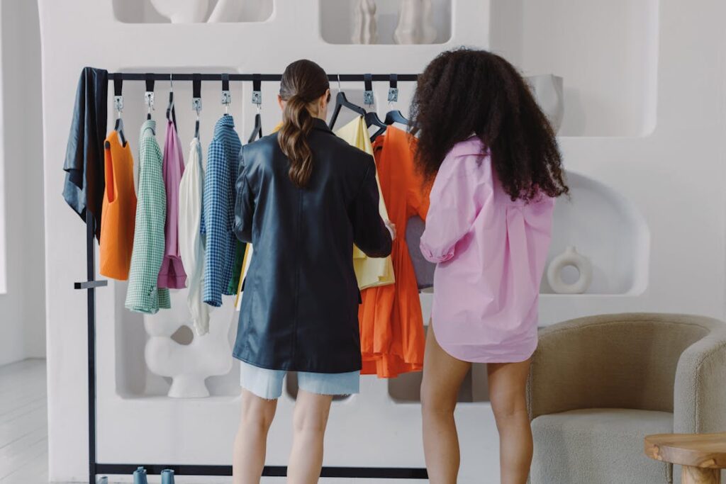 Free Women Looking at Clothes on Rack Stock Photo